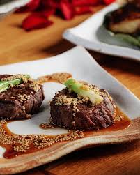 Zuma Miami signature dishes Prawn and Black Cod Dumplings, Beef Tenderloin, Rice Hot Pot with Wild Mushrooms, Chilean Sea Bass